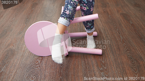 Image of Child overstepping chair