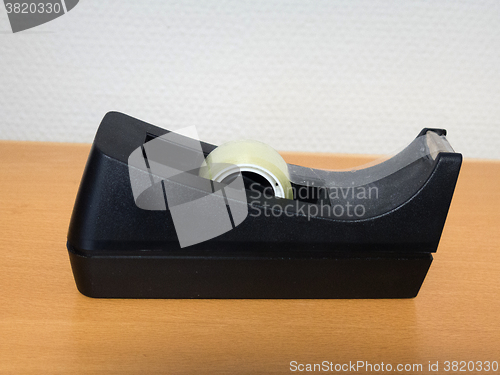 Image of one tape dispenser on the table