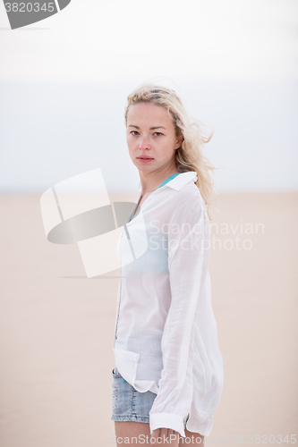 Image of Beautiful sensual girl alone at beach.