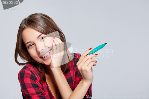 Image of Surprised woman with a pen