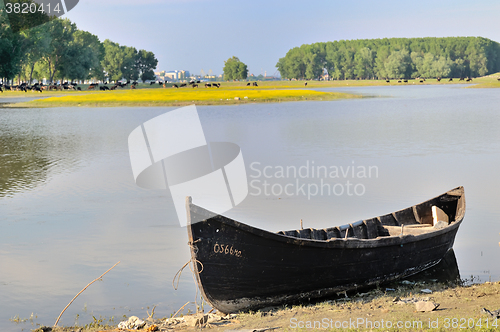 Image of alone fishing boat on danube river
