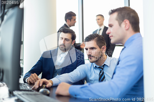 Image of Business team working in corporate office.