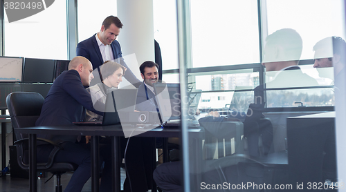 Image of Business team working in corporate office.