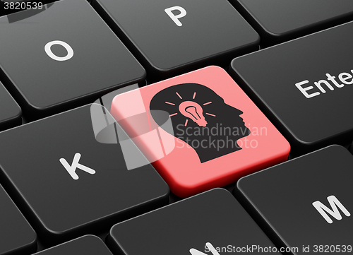 Image of Finance concept: Head With Light Bulb on computer keyboard background