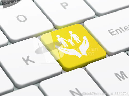 Image of Insurance concept: Family And Palm on computer keyboard background