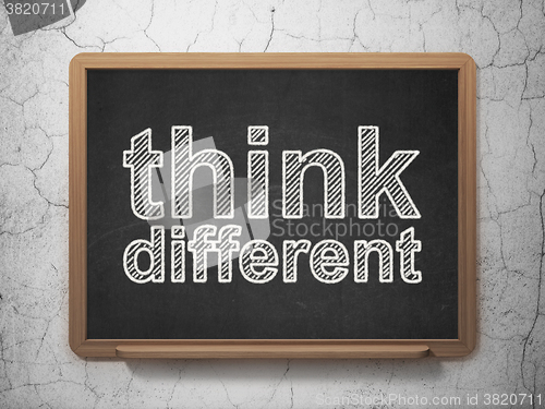 Image of Education concept: Think Different on chalkboard background