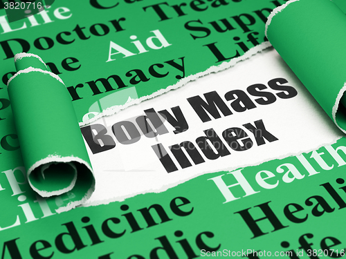Image of Medicine concept: black text Body Mass Index under the piece of  torn paper