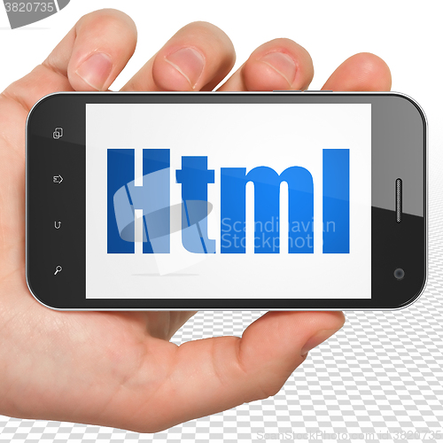 Image of Software concept: Hand Holding Smartphone with Html on display