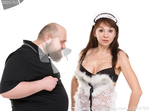 Image of Fat Man Lustfully Watching on Breast Attractive Woman in Lingeri