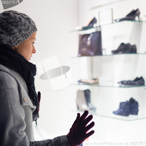 Image of Woman window shopping.