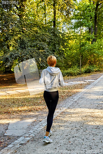 Image of Anorexic woman running in park