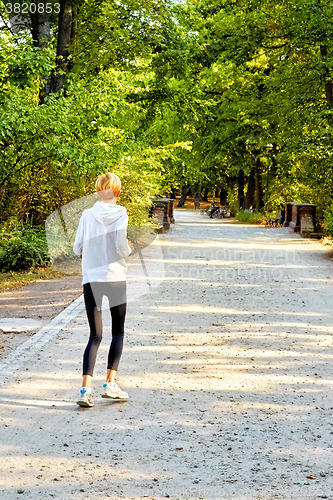 Image of Anorexic woman running in park