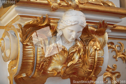 Image of mascaron female head in the Baroque style