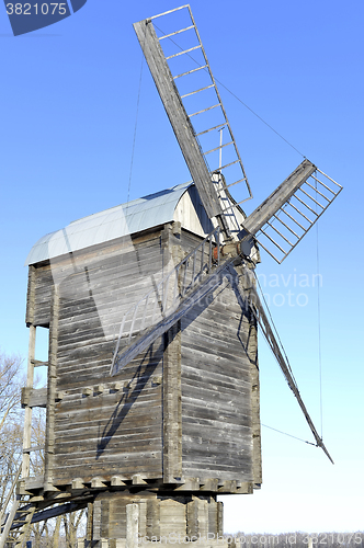 Image of Old wooden windmill close up in winter