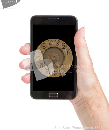 Image of Senior woman hand with smart phone isolated, old fashion dial