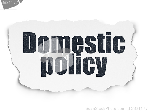 Image of Political concept: Domestic Policy on Torn Paper background