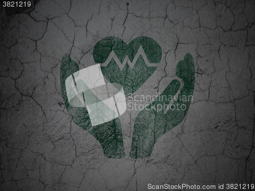 Image of Insurance concept: Heart And Palm on grunge wall background