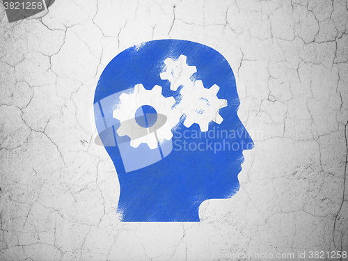 Image of Education concept: Head With Gears on wall background