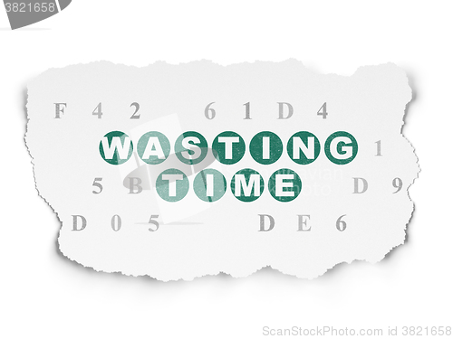 Image of Time concept: Wasting Time on Torn Paper background