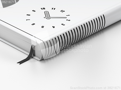 Image of Time concept: closed book, Clock on white background