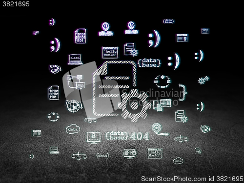 Image of Programming concept: Gear in grunge dark room