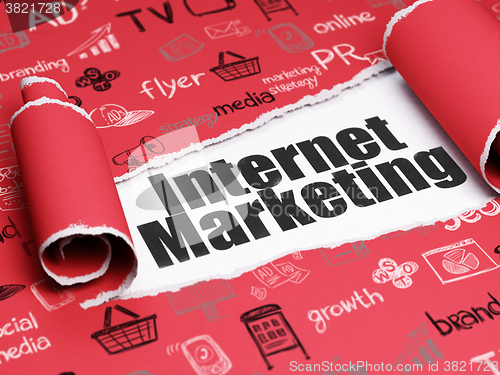 Image of Marketing concept: black text Internet Marketing under the piece of  torn paper