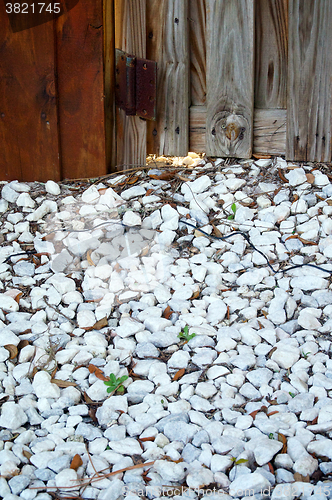 Image of marble chip walkway with fence