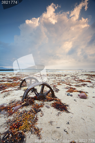 Image of Rusty wheels in the sand