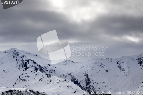 Image of Snowy mountains and gray sky before blizzard