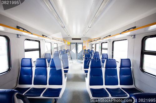 Image of Rows of seats in a passenger train carriage