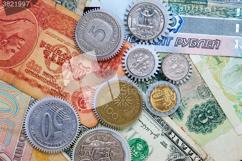 Image of Coins gearweels on the money background