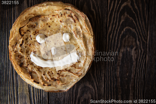Image of Fried tasty smiling pancakes 