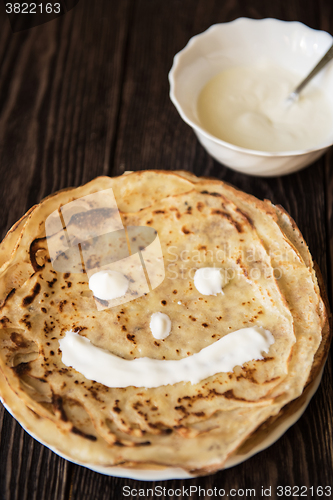 Image of Fried tasty smiling pancakes 