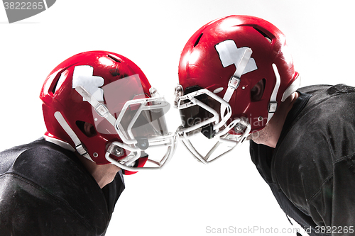 Image of The two american football players fighting on white background