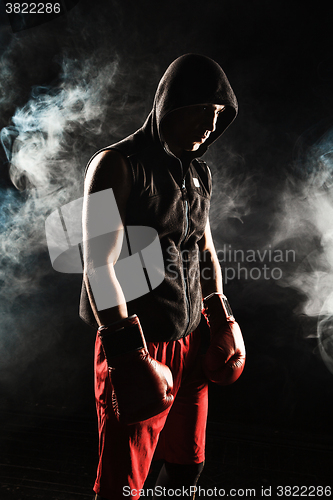 Image of The young  man kickboxing 