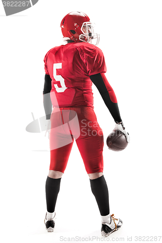 Image of American football player posing with ball on white background