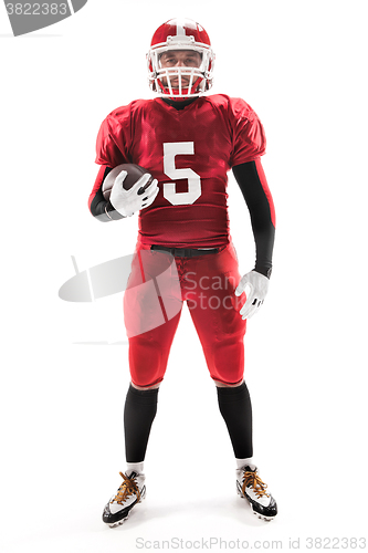 Image of American football player posing with ball on white background