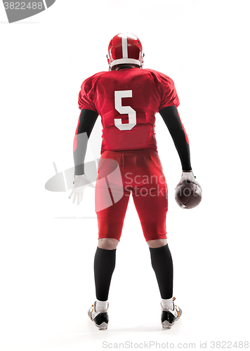 Image of American football player posing with ball on white background