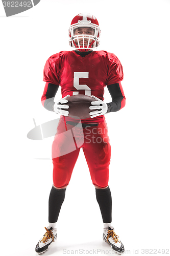 Image of American football player posing with ball on white background