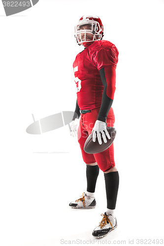 Image of American football player posing with ball on white background