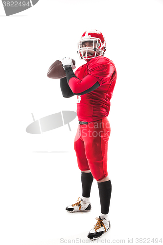 Image of American football player posing with ball on white background