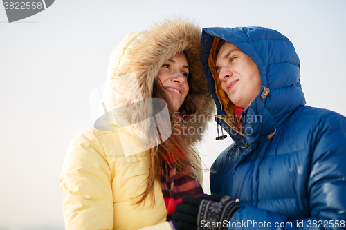 Image of beautiful couple embracing in winter