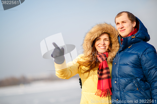 Image of beautiful couple embracing in winter