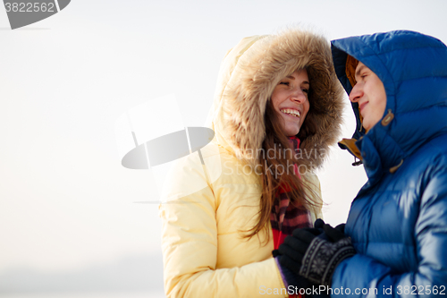 Image of beautiful couple embracing in winter