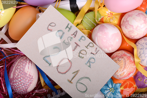 Image of Easter background with eggs, ribbons and spring decoration