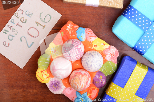 Image of holiday gift box with painted easter eggs