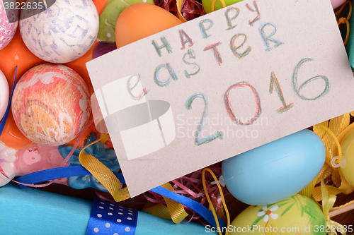 Image of Easter background with eggs, ribbons and spring decoration