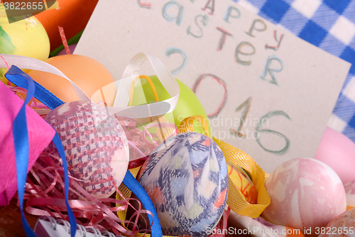 Image of Easter background with eggs, ribbons and spring decoration