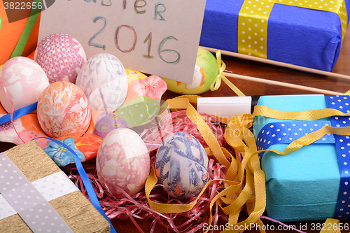 Image of Easter background with eggs, ribbons and spring decoration