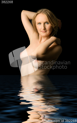 Image of topless woman in dark water